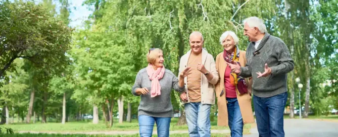 Senior Residents taking preventive health in assisted living by walking everyday with peers to keep their body active